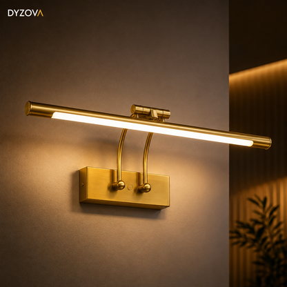 A modern wall-mounted light bar with a brushed gold finish, shown lit against a warm brown wall. The brand name 'DYZOVA' is visible in the top left corner.