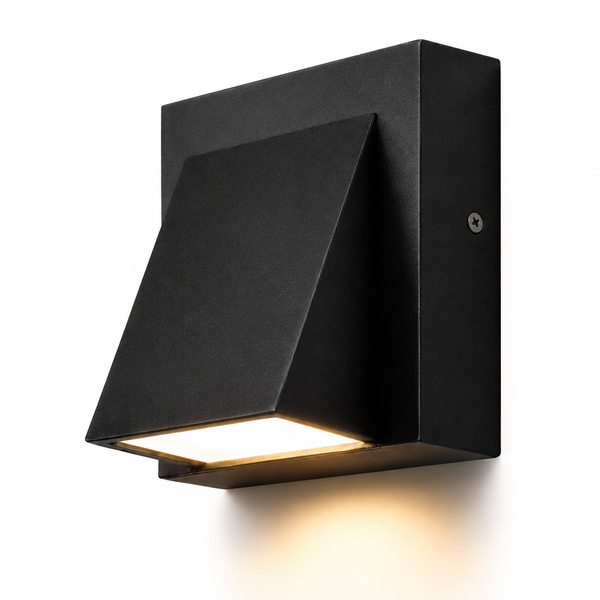A modern black metal outdoor wall sconce with a geometric, angled shade design that directs light downward, shown illuminated against a plain white background.