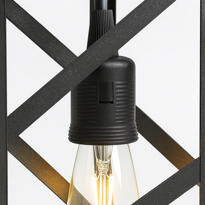 Close-up of a black light fixture with a clear bulb against a geometric patterned background.