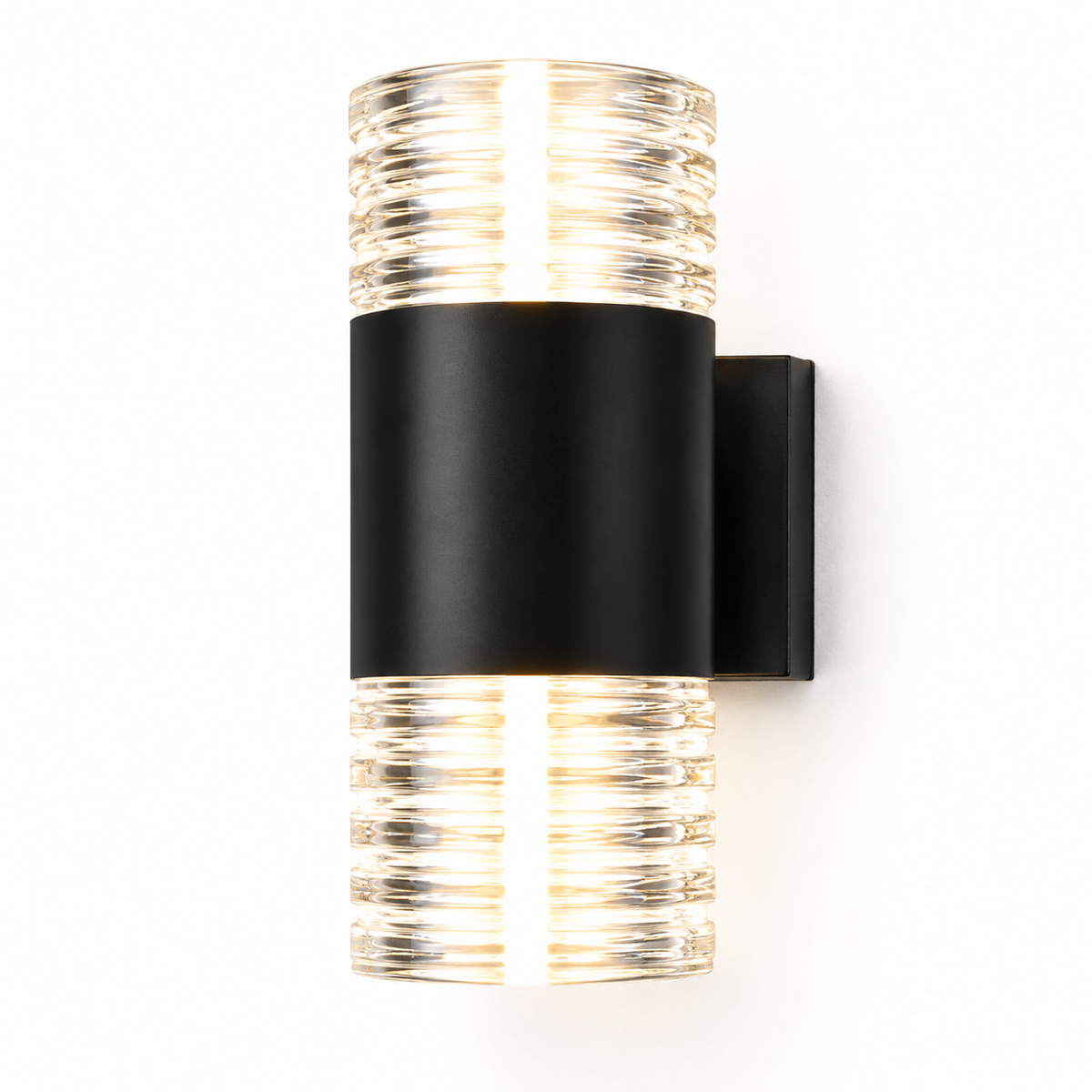 A modern wall-mounted light fixture with a matte black cylindrical band and clear ribbed glass top and bottom sections, shown lit against a plain white background.